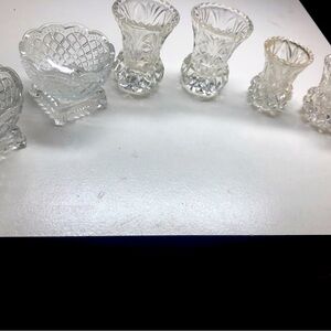 Set of six small glass vases, each set has two